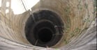 Bricked well as a water source for crops that severely lack water.