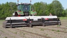 Prototype camera sensor system for assessing number and size of potatoes on harvester.